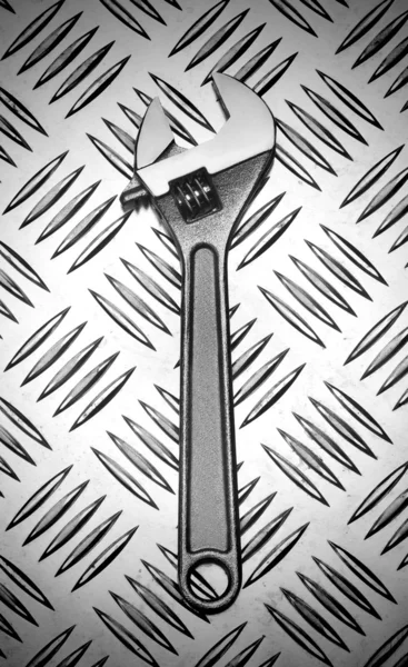 Wrench on metal — Stock Photo, Image