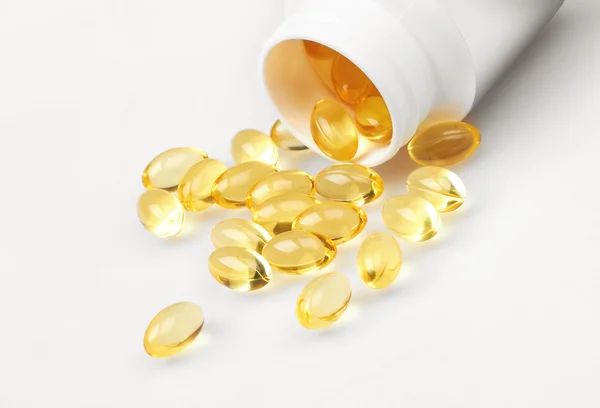 Sárga tablettákat és pirulát üveg — Stock Fotó