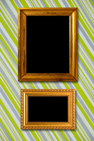 Gold frame on striped vintage wallpaper background — Stock Photo, Image