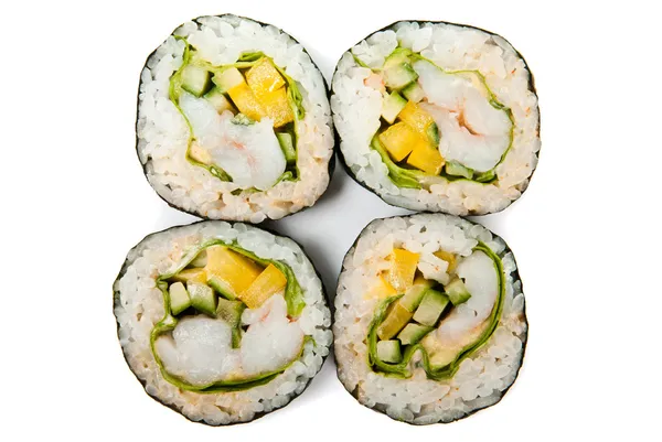 Quattro rotoli di sushi su sfondo bianco — Foto Stock