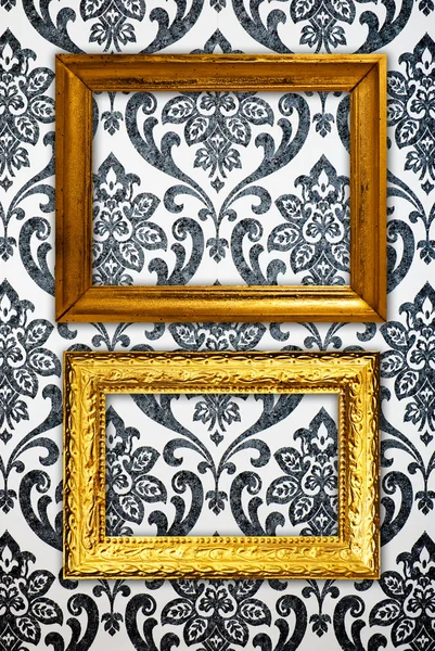 Gold frame on vintage wallpaper background — Stock Photo, Image