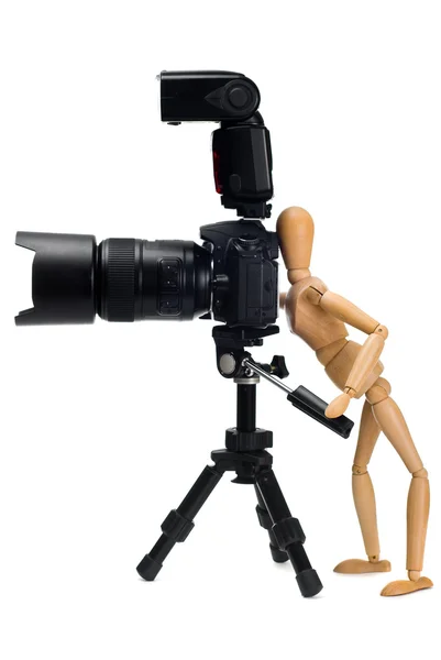 The wooden figure of photographer who photographed SLR camera on — Stock Photo, Image