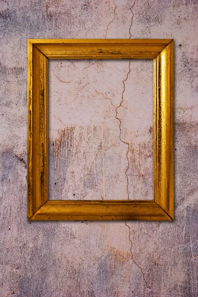 Gold frame on a old wall background — Stock Photo, Image