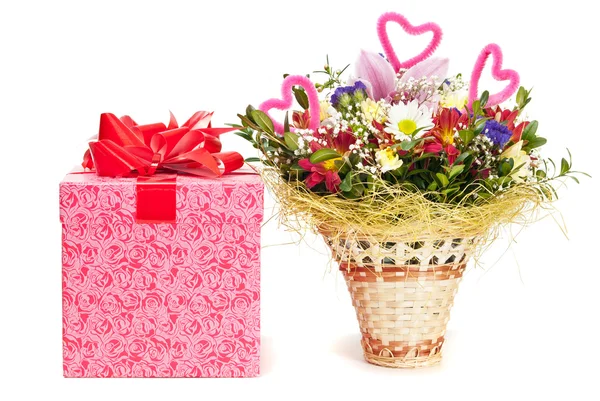 Beautiful bouquet in the basket and present box on a white backg — Stock Photo, Image