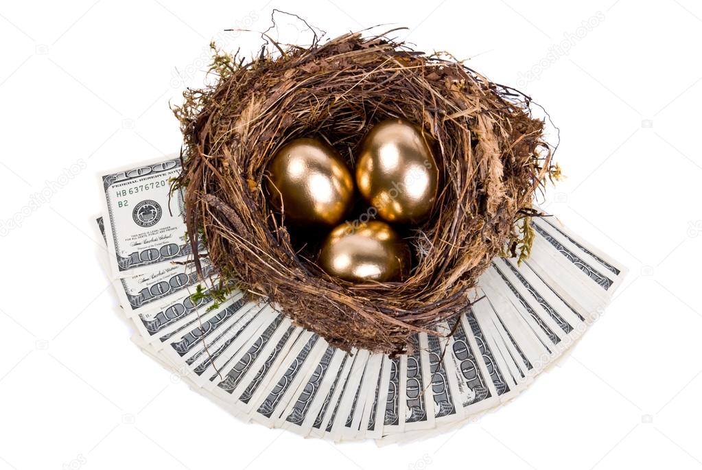 Three golden eggs in the nest. A symbol of making money and succ