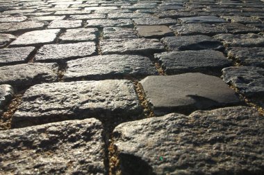 Soyut arkaplan. Eski taş kaldırımın dokusu ve detayları.