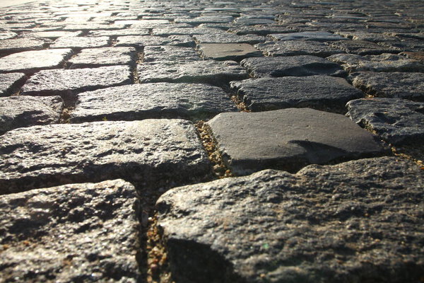 Abstract background. Texture and details of the old stone pavement.