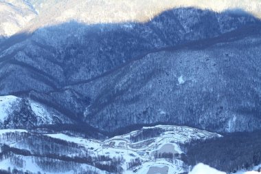 View of snow covered Roza Peak on ski resort Roza Khutor.