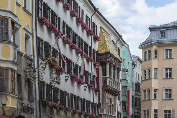 INNSBRUCK, AUSTRIA - AUG 14: The Golden Roof, ornamented with 2,738 fire-gilded copper tiles for Emperor Maximilian I to mark his wedding to Bianca Sforza on Aug 14, 2013 in Innsbruck, Austria.