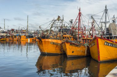 Orange fishing boats in Mar del Plata, Argentina clipart