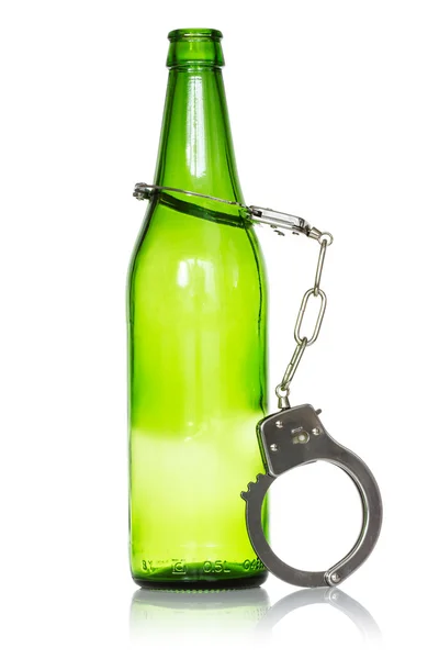 Flaska och handfängsel — Stockfoto