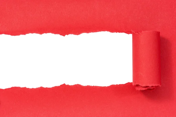 Hole ripped in red paper — Stock Photo, Image