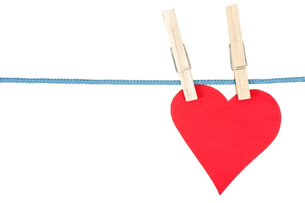 Red paper heart on a clothespins — Stock Photo, Image