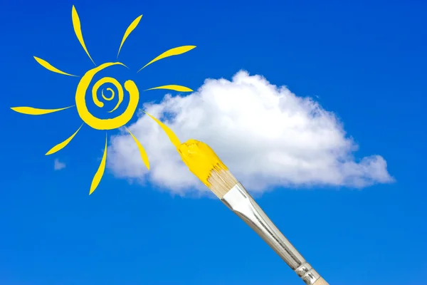 Paintbrush painting the sun in a sky — Stock Photo, Image