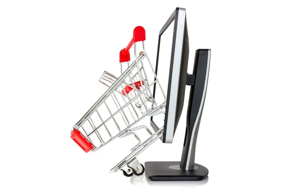 Shopping cart comes out of a monitor — Stock Photo, Image