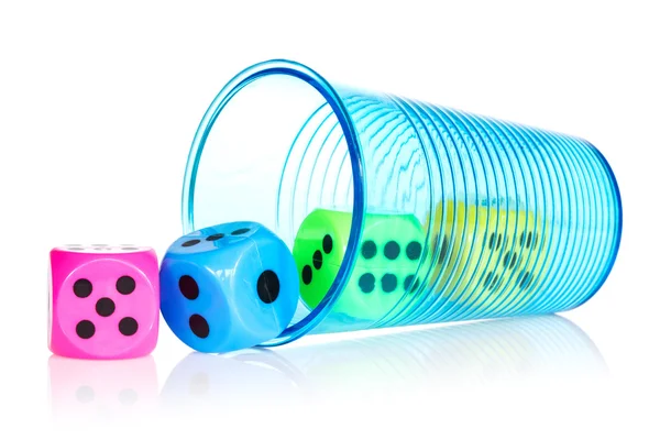 Plastic cup with colorful dice — Stock Photo, Image