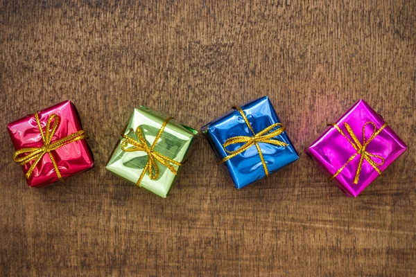 Little gift boxes on the floor — Stock Photo, Image