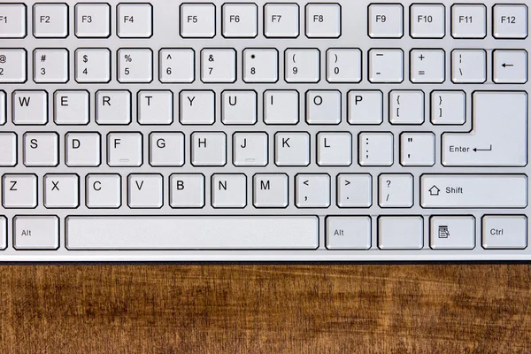 Клавіатура на дерев'яному столі — стокове фото