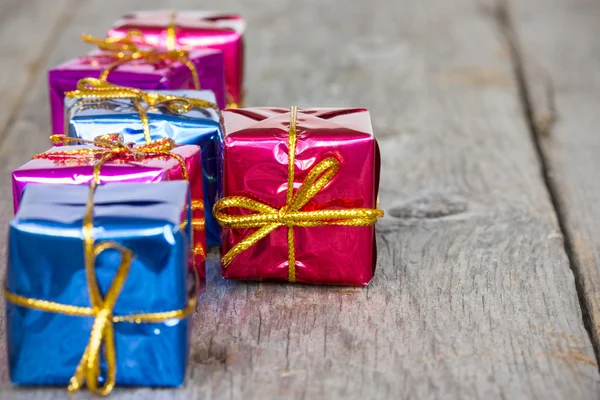 Row of glossy gifts — Stock Photo, Image