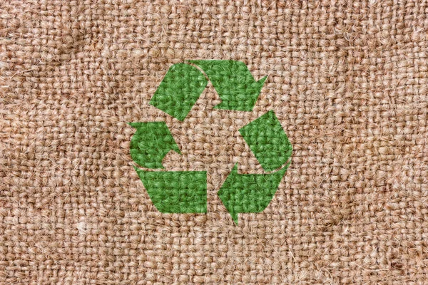 Τραχύ καμβά με σύμβολο ανακύκλωσης — Φωτογραφία Αρχείου