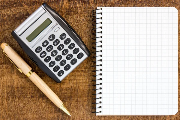 Notebook with pen and calculator — Stock Photo, Image