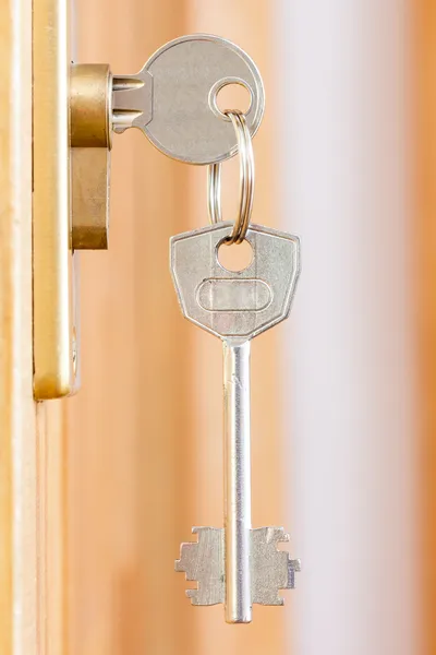 Door lock with keys macro shot — Stock Photo, Image