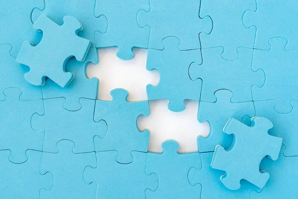 Two Puzzle Pieces Revealing White Background Business Teamwork Solution Concept — Stock Photo, Image
