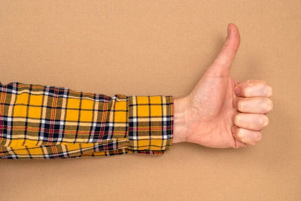 Hand Thumb Upwards Brown Paper Background Copy Space — Fotografia de Stock