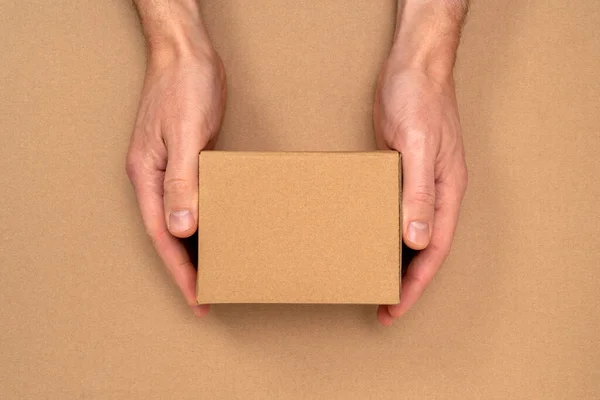 Hands Small Cardboard Box Packaging Delivery Top View Copy Space — Fotografia de Stock