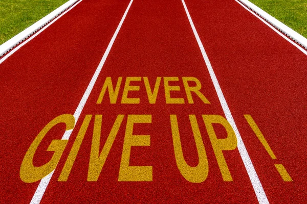 Never Give Written Stadium Running Track — Stock Photo, Image