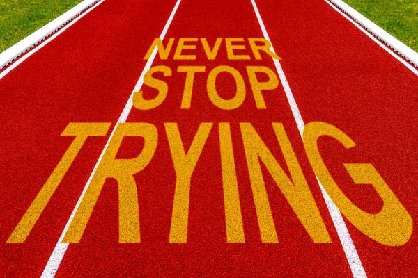 Never Stop Trying Written Red Stadium Running Track — Stock Photo, Image