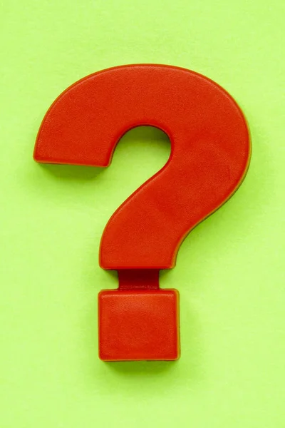 Red Plastic Question Mark Green Background — Stock Photo, Image