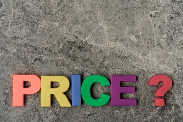 PRICE word with a question mark written in color plastic letters