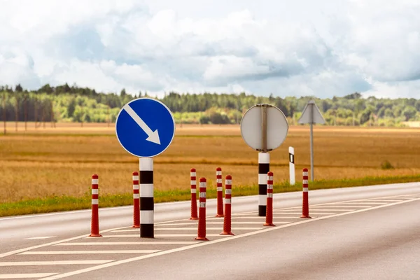 Orange cones and road signs for traffic control on the highway, road marking