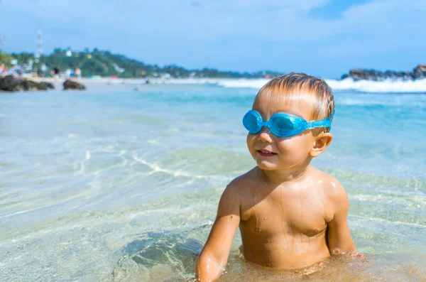 Playful boy in swimming goggles — Stock Photo, Image