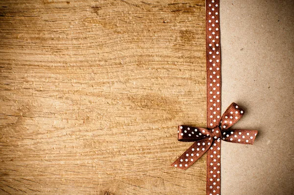 Background with brown ribbon and kraft paper — Stock Photo, Image