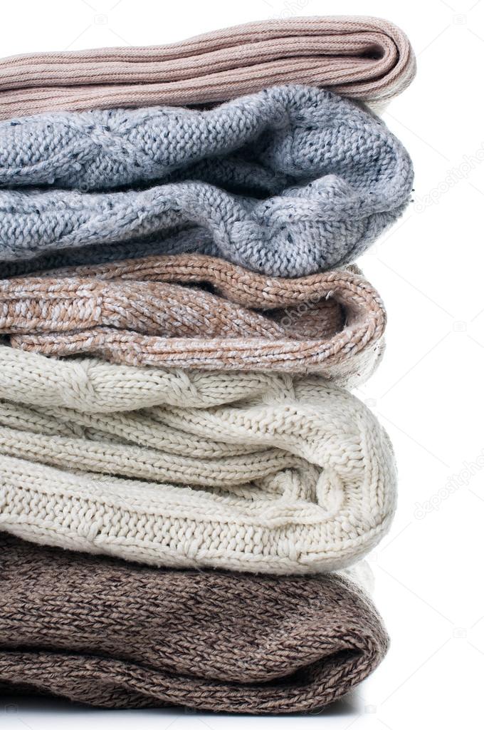 tack of warm knitted sweaters