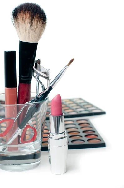 Eyeshadows, lipstick, eyelash curlers and make-up brushes — Stock Photo, Image