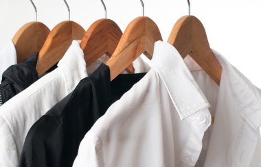 Black and white clothes on a rack, close-up clipart
