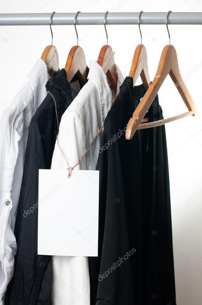 Black and white clothes on a rack