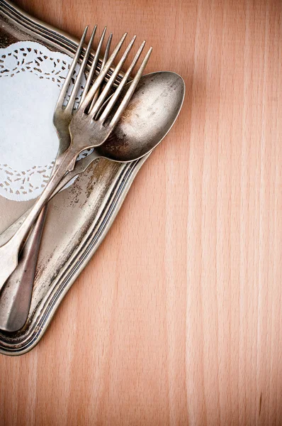 Vintage cutlery tray and old wooden board — Stock Photo, Image