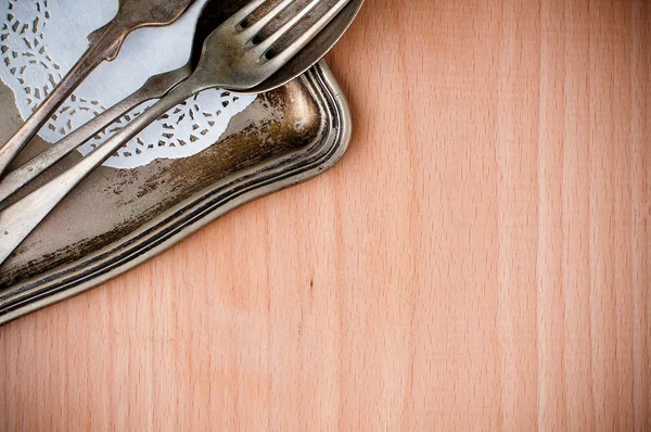 Vintage cutlery tray and old wooden board — Stock Photo, Image