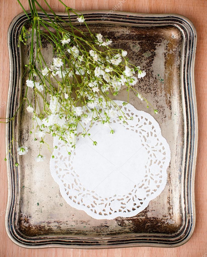 Vintage tray, white napkin and flowers