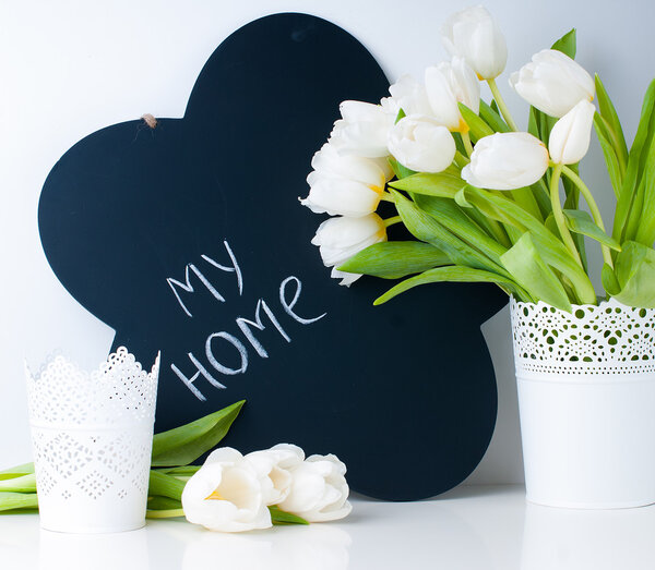 white tulips and chalk board