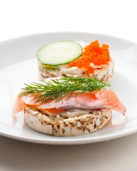 Appetizers with red fish and red caviar — Stock Photo, Image