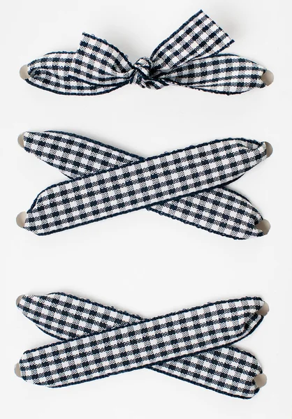 Lacing of black and white checkered ribbon — Stock Photo, Image