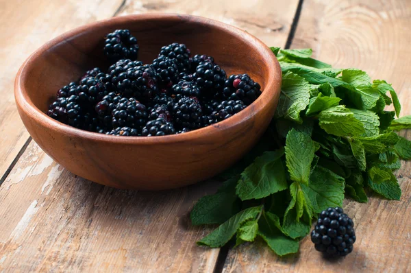 Blackberries in a wooden bowl — Stock Photo, Image