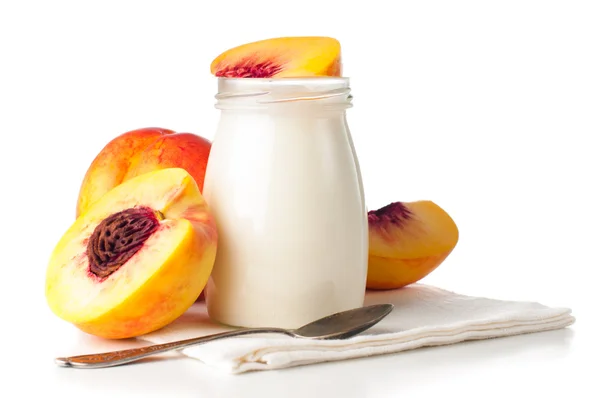 Jar of yogurt and sliced nectarines — Stock Photo, Image