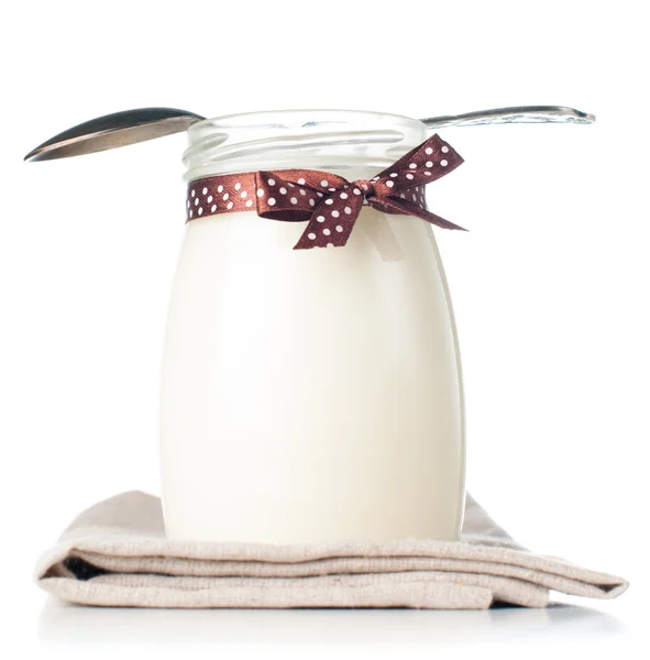 Jar of yogurt with a polka dot ribbon — Stock Photo, Image