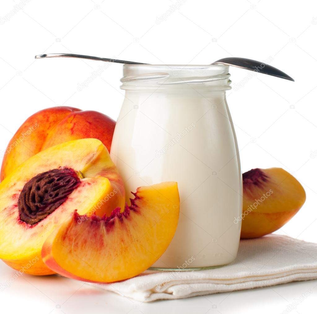 Jar of yogurt and sliced nectarines